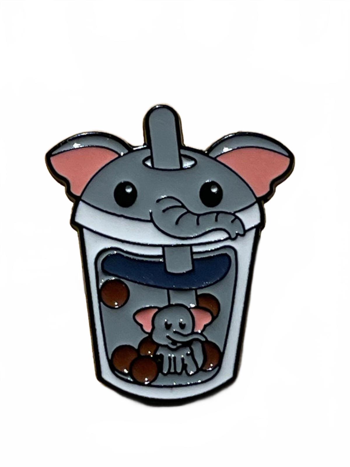 Enamel pin of a cartoon elephant in a bubble tea cup on a white background