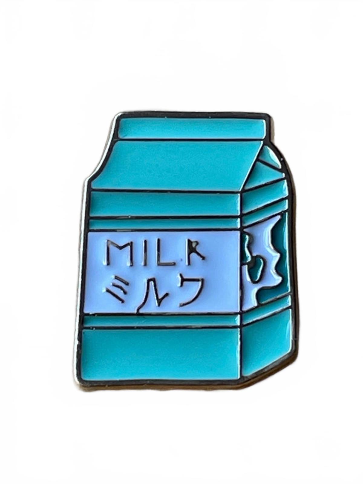 Cute kawaii green milk carton enamel pin on a white background