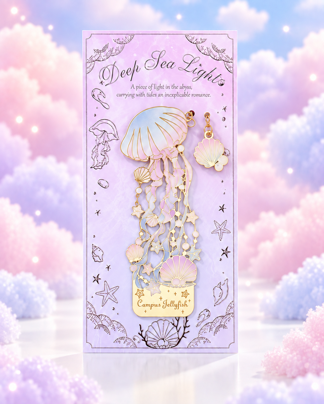 Lilac packaged gold-tone metal bookmark with pastel jellyfish, shells and star details.