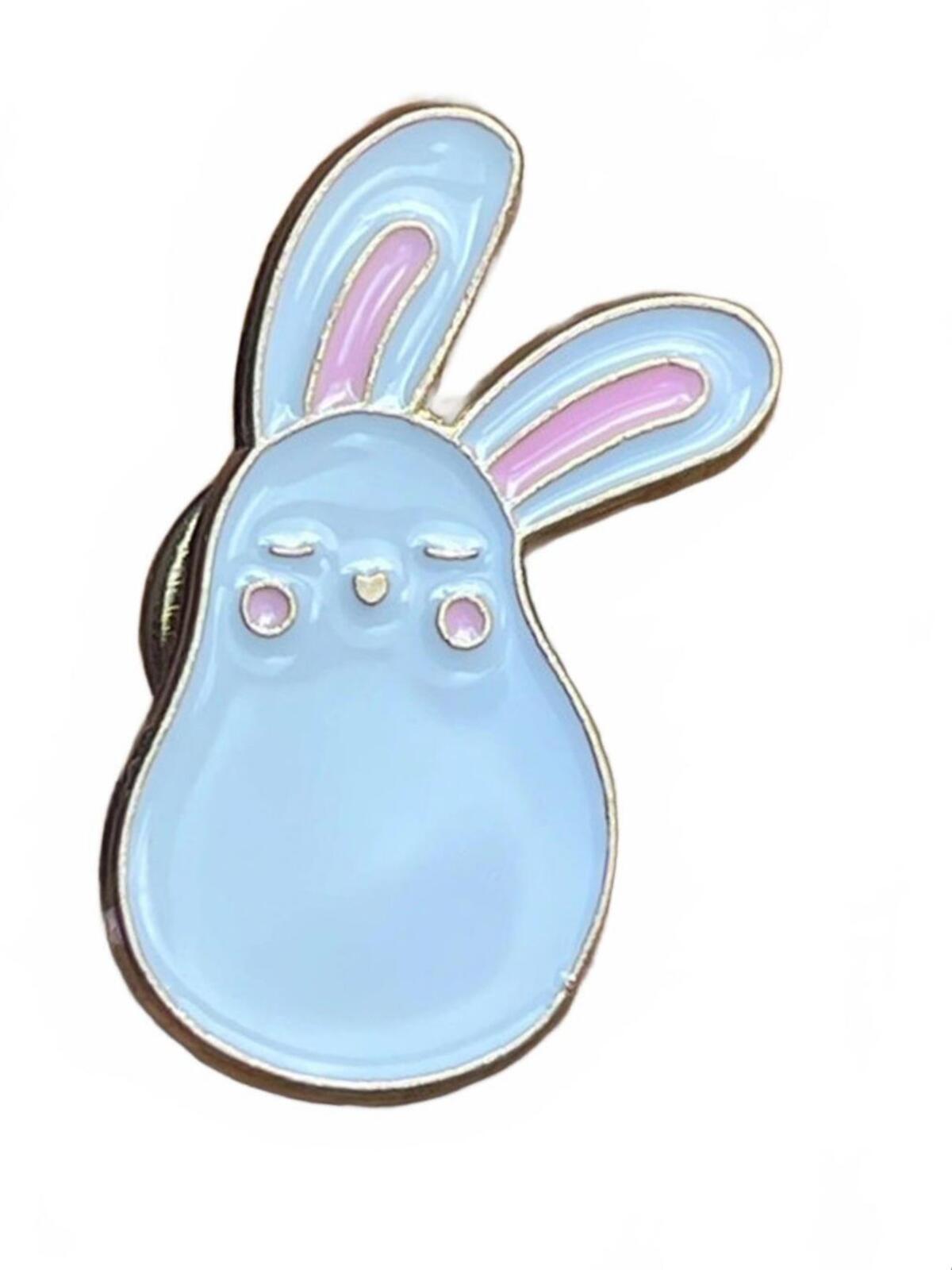 White bunny-shaped enamel pin with pink inner ears and pink cheeks on a white background