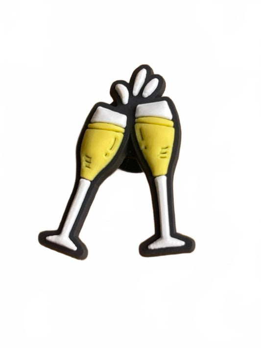 Two champagne flute glasses shoe charm on a white background