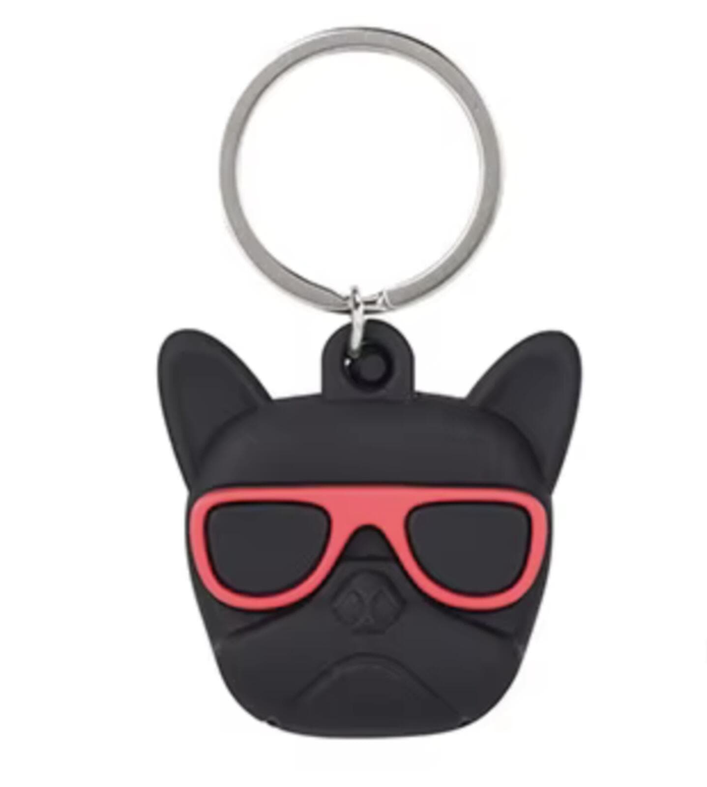 Black dog-shaped keychain with red sunglasses on a white background