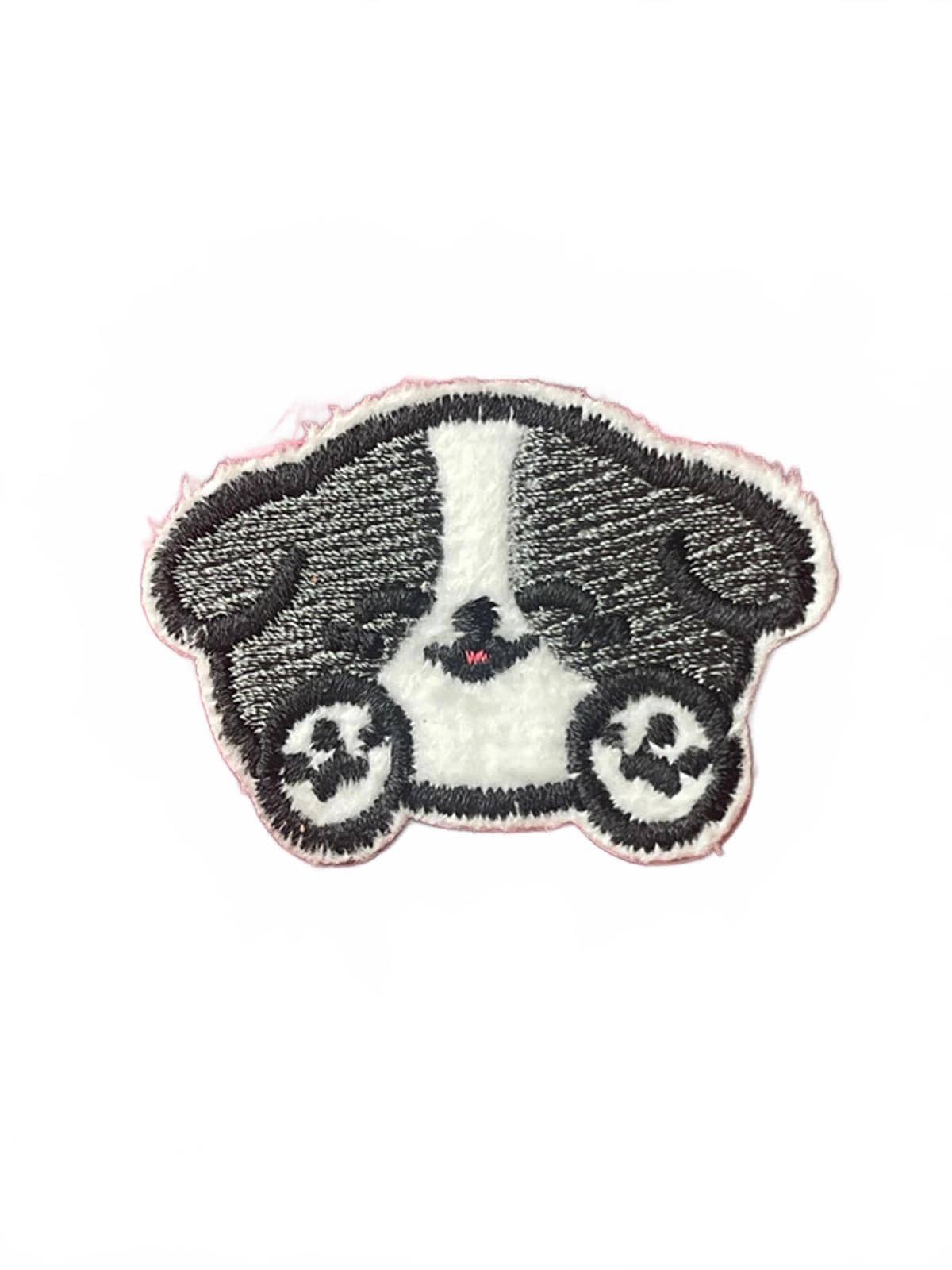 Cute embroidery patch of black and white dog with paws