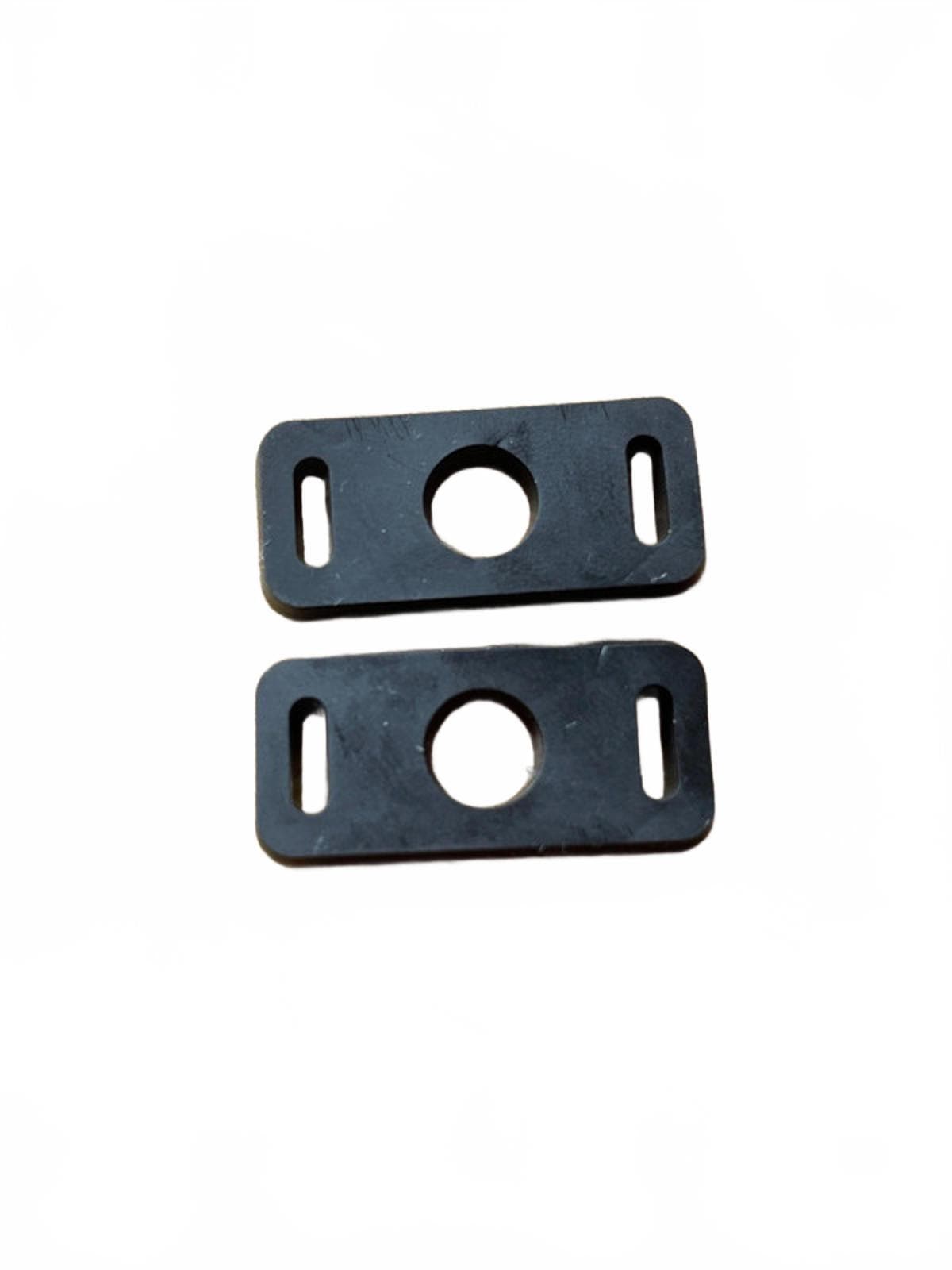 Two black clip shoe adaptors on a white background