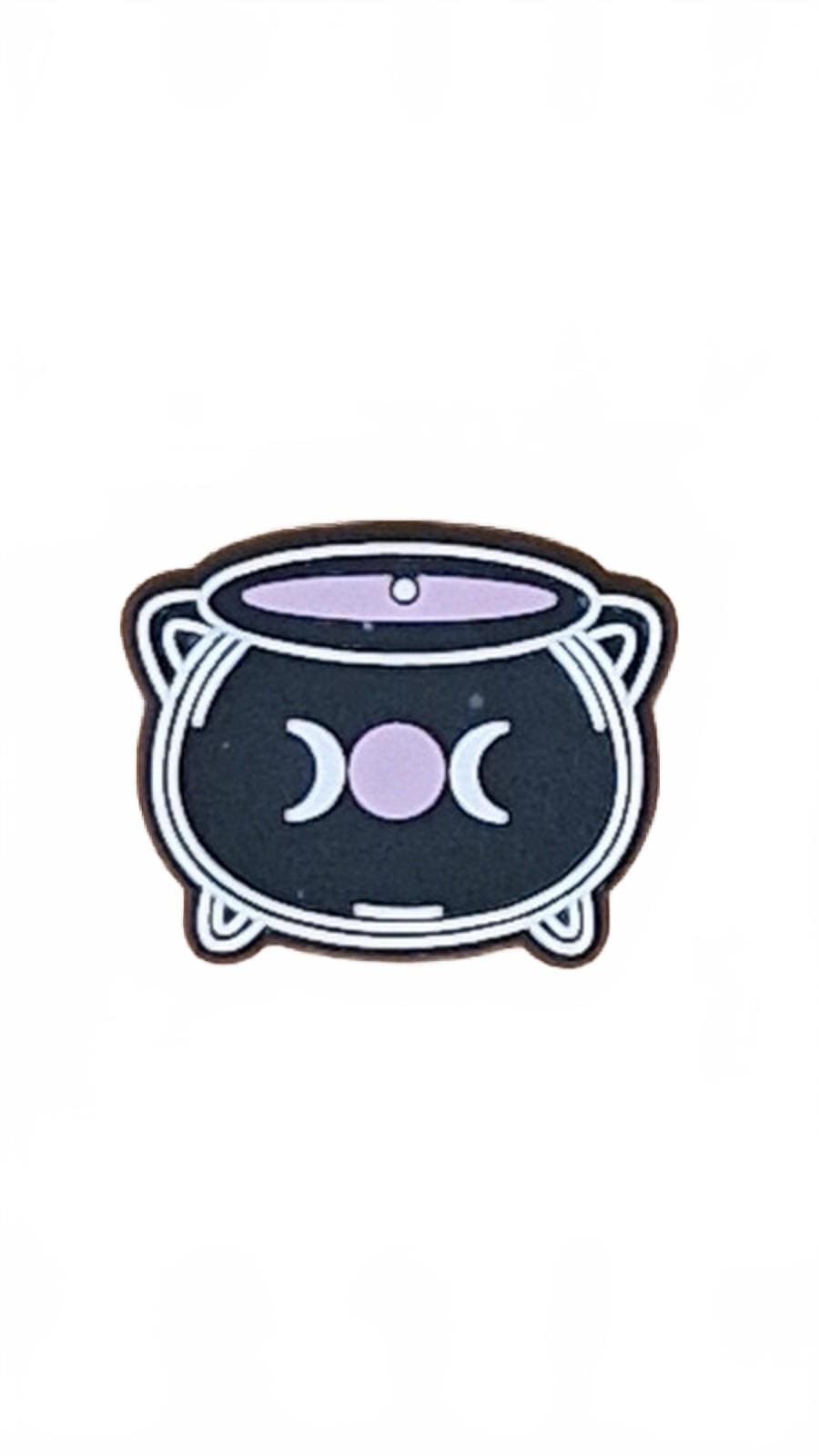 Black cauldron with moon Halloween shoe charm.
