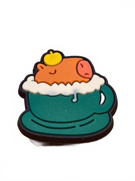 Cute capybara bathing in green cup with foam and apple on head shoe charm