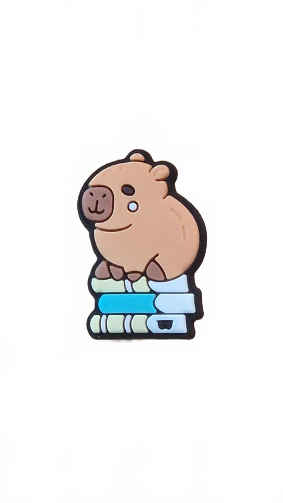 Cute capybara sitting on pile of books shoe charm
