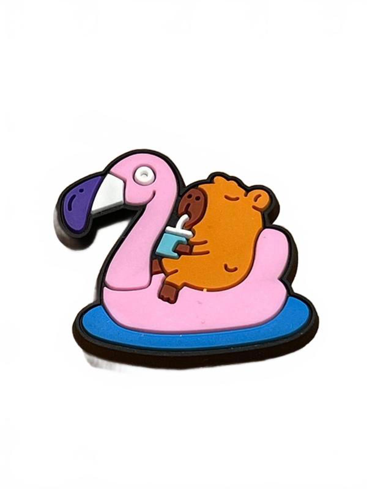 Cute capybara drinking cocktail sitting on pink inflatable flamingo shoe charm