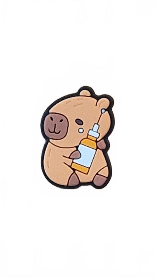 Cute capybara holding medical syringe shoe charm