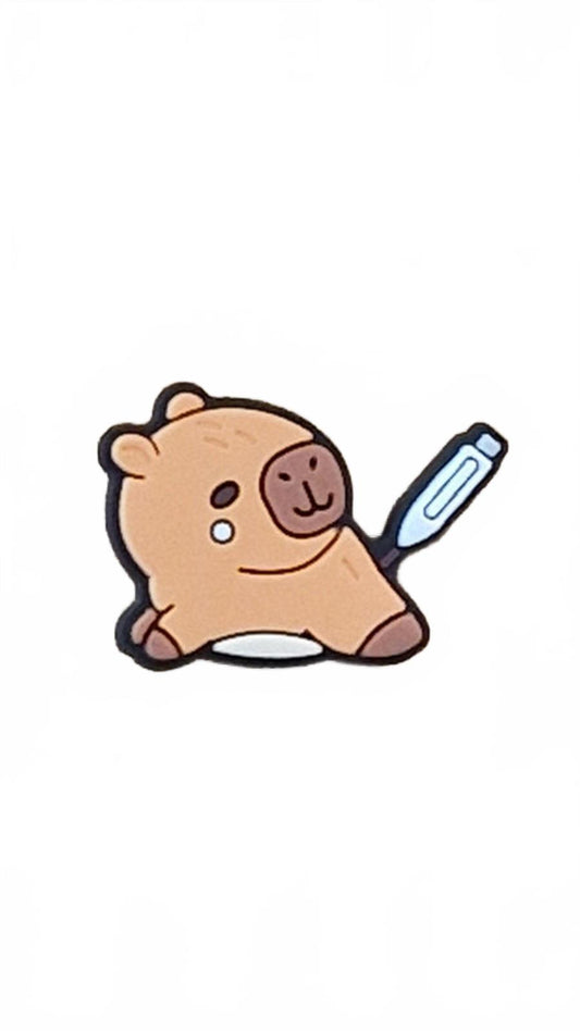 Cute capybara crying with thermometre in butt shoe charm