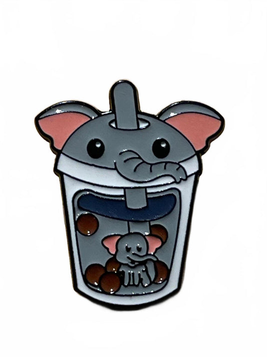 Enamel pin of a cartoon elephant in a bubble tea cup on a white background