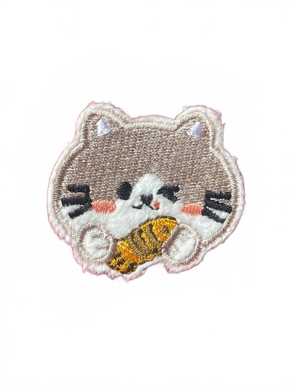 Embroidered patch of a cat holding a fish on a white background