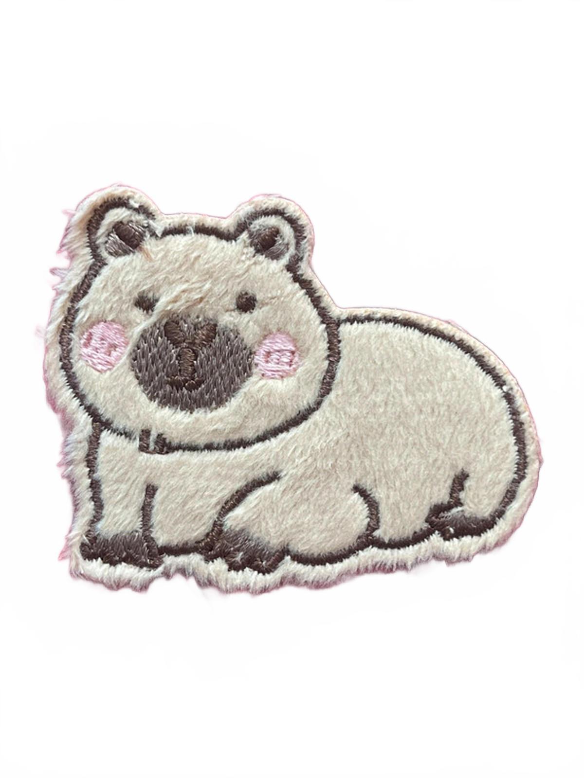 Embroidered patch of a capaybara on a white background