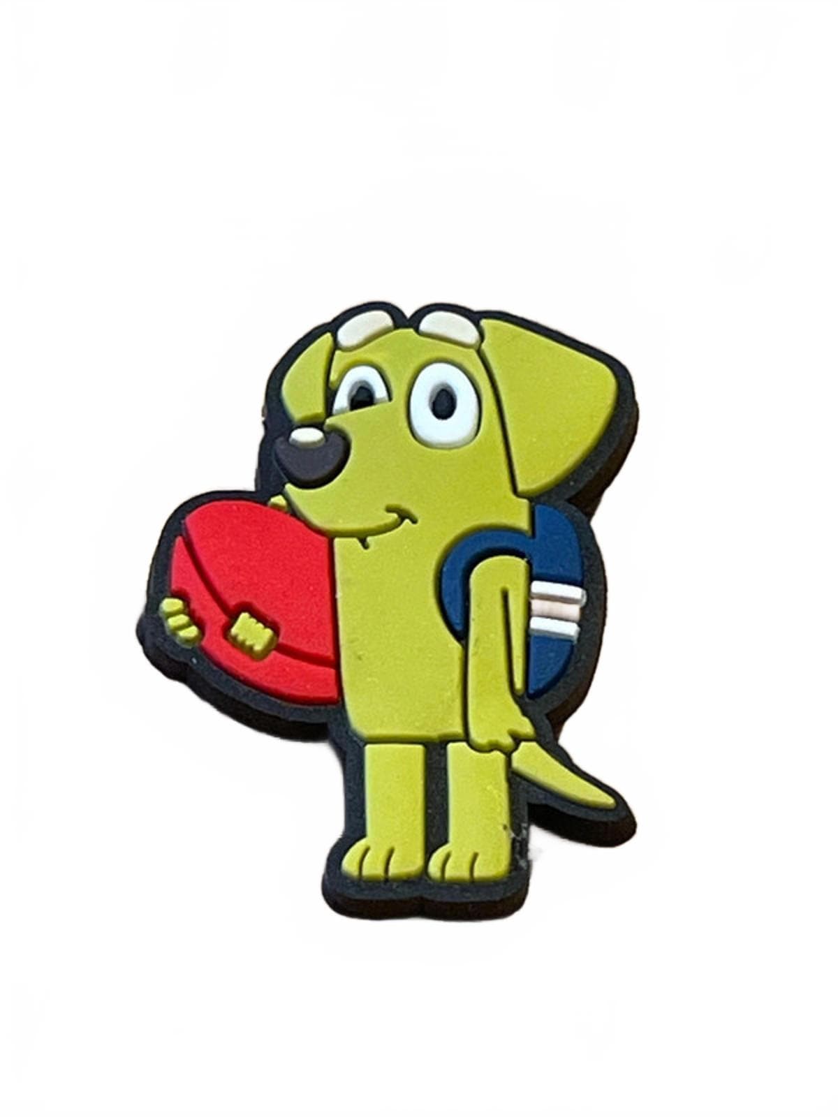 Cute cartoonish dog wearing backpack and holding ball shoe charm