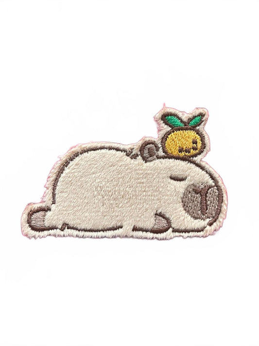 Embroidered patch of capybara sleeping