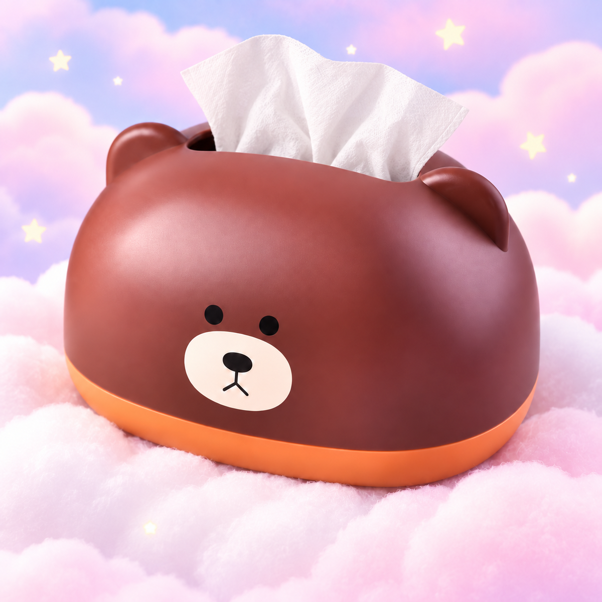 Brown bear tissue box holder with an orange base on a pastel pink and lilac cloud background.