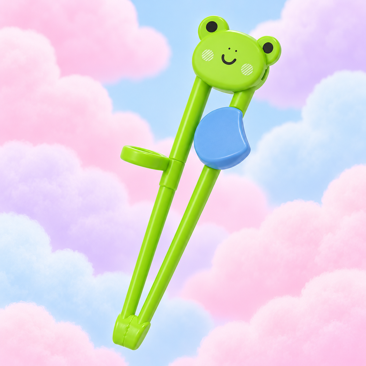 Packaged green frog training chopsticks with a guide ring on fluffy pastel clouds.