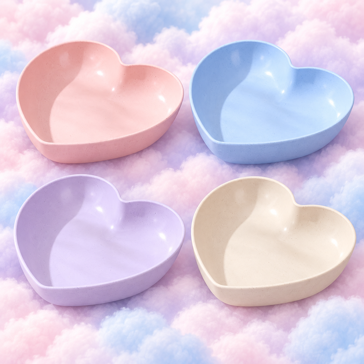 Pink, blue, lilac and cream heart-shaped bowls together on fluffy pastel clouds.