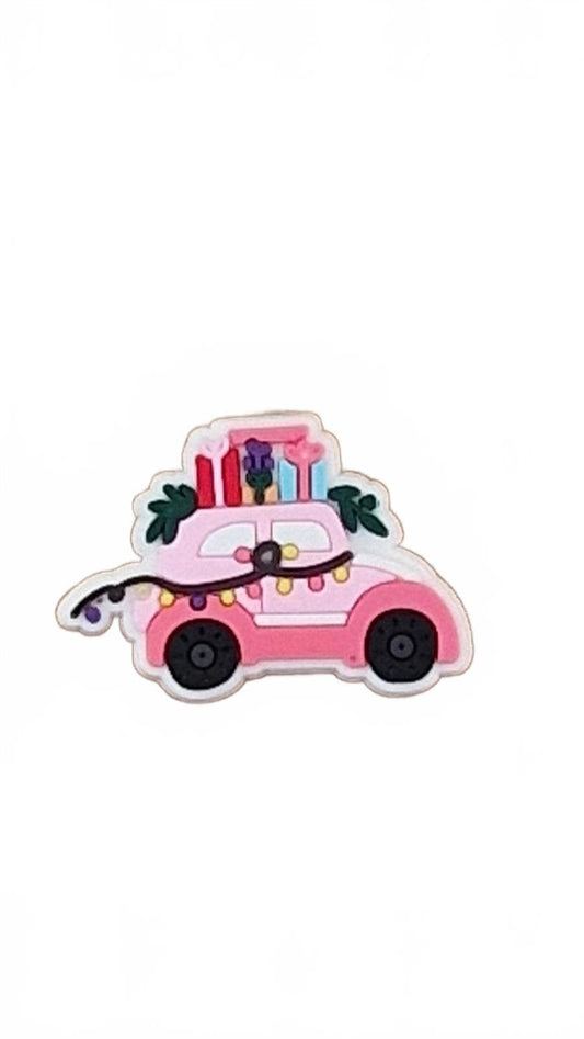Cute pink car covered in Christmas lights and presents Christmas shoe charm