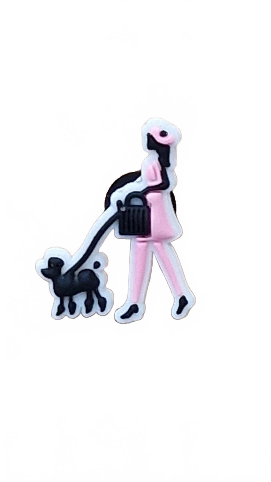 Lady in pink with black bag walking black poodle dog shoe charm