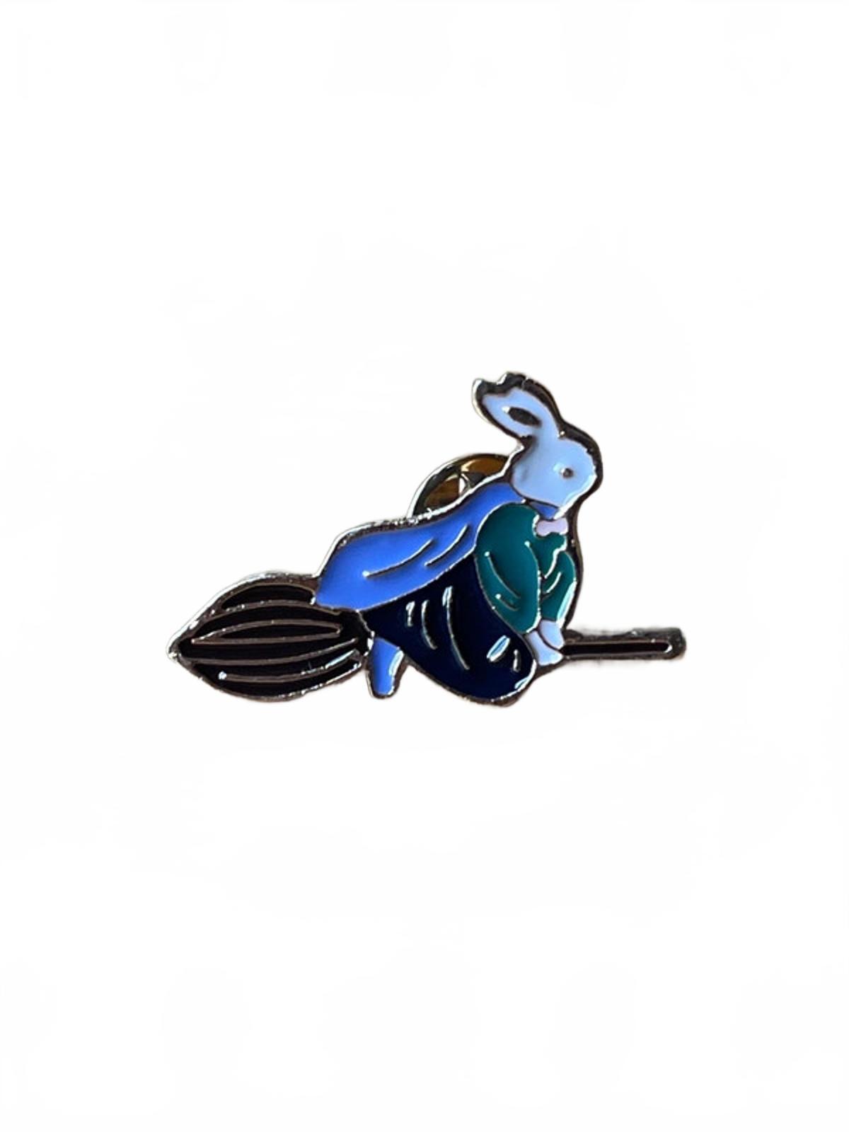 Cute enamel pin with rabbit flying on a broomstick