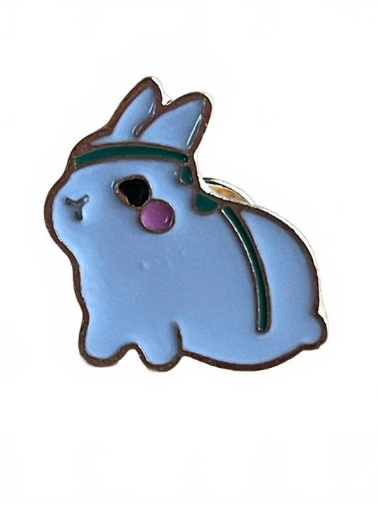 Cute rabbit with pink cheeks wearing green headband enamel pin