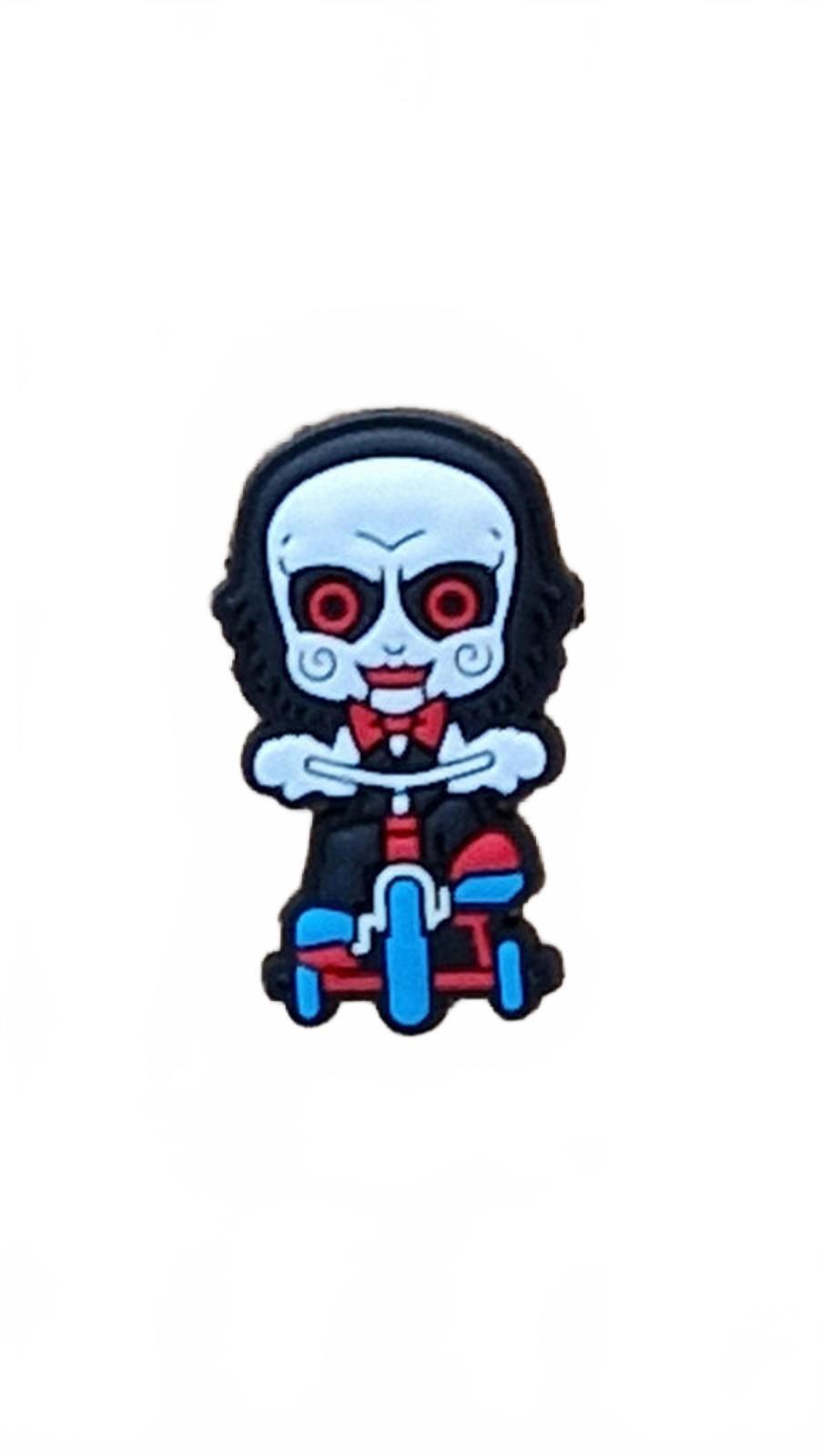 Scary doll with big red eyes and a big head riding tricycle Halloween shoe charm