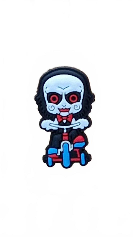 Scary doll with big red eyes and a big head riding tricycle Halloween shoe charm