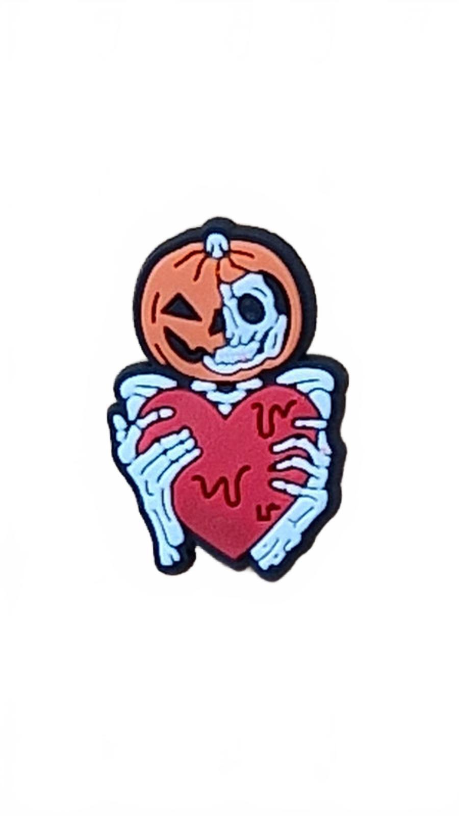 Skeleton holding melting red heart with pumpkin hat shoe charm