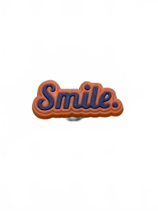 Blue and orange smile badge shoe charm
