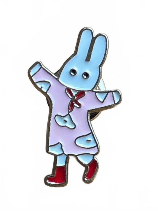 Enamel pin of a cartoon rabbit character in pink pajamas on a white background