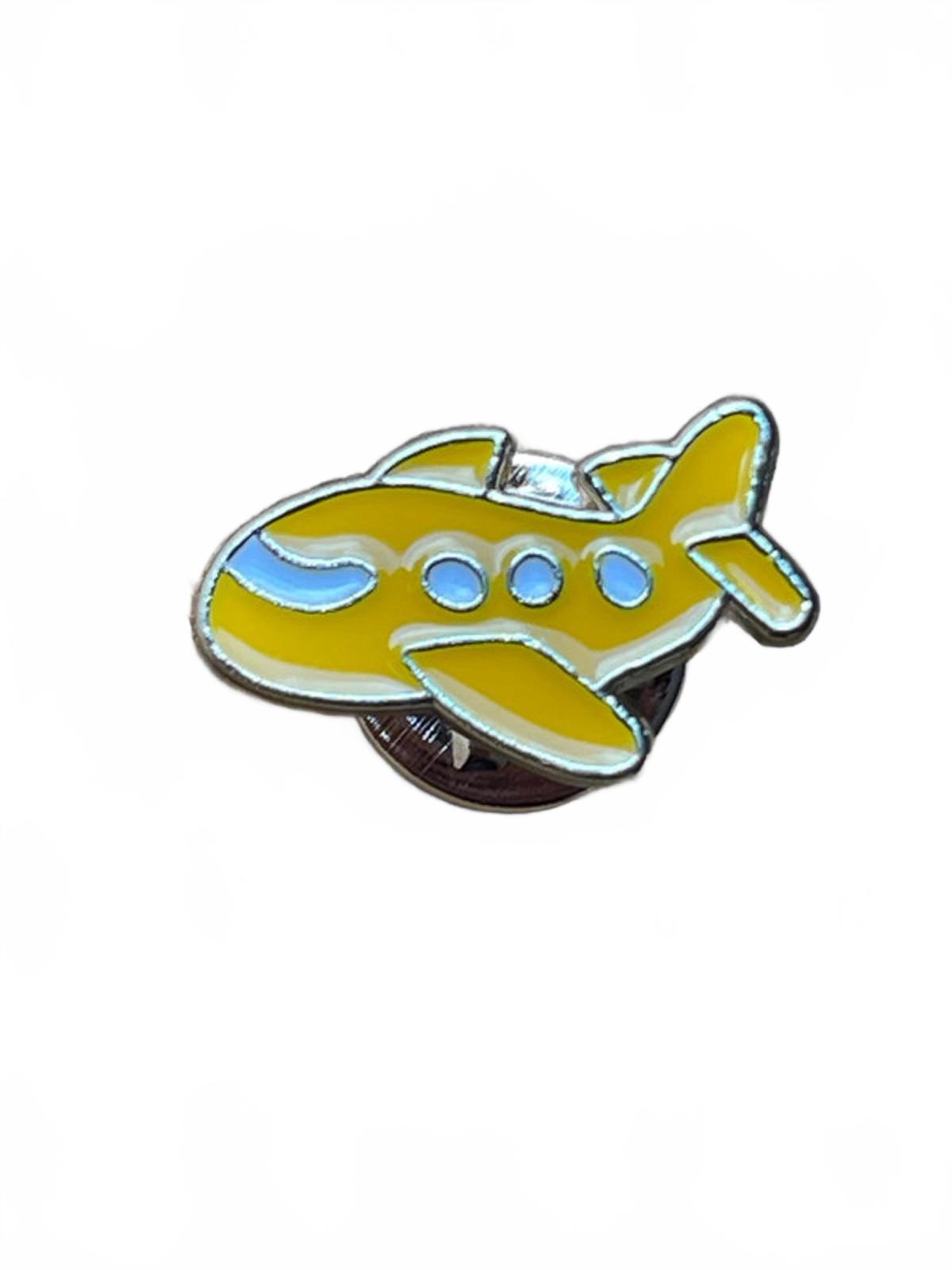 Yellow airplane-shaped pin on a white background